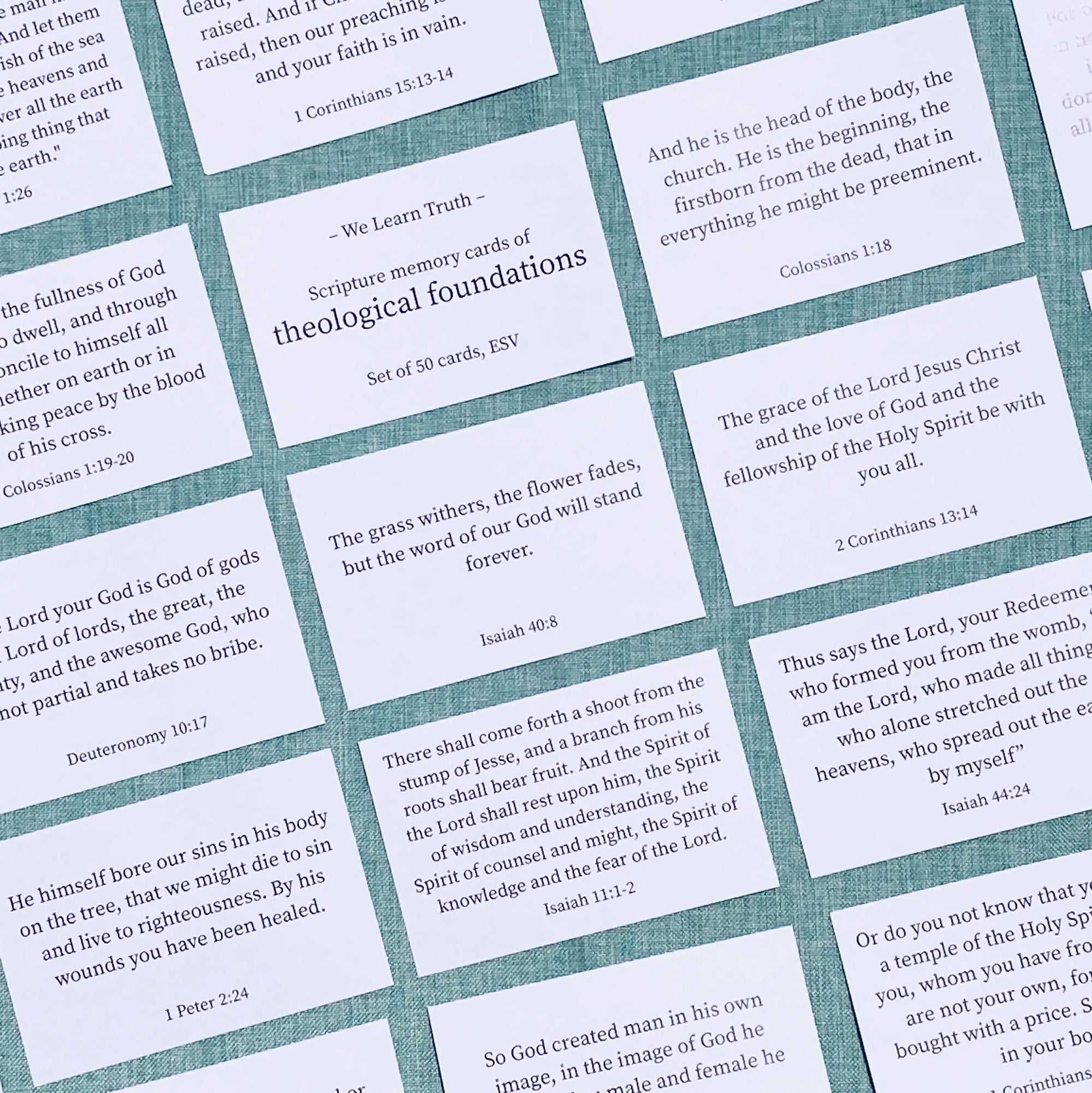 Set of scripture memory cards with text on a textured surface